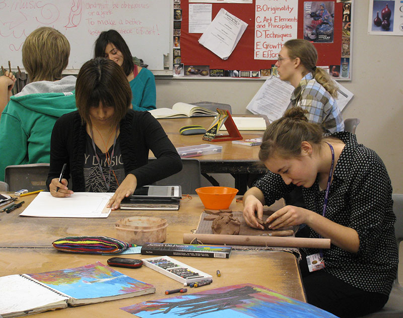 Students work on projects in Cindy Cooper's Ib art class.